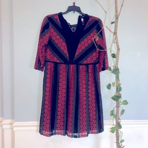 A line dress in red black & green with crochet lace details, very breathable. M.